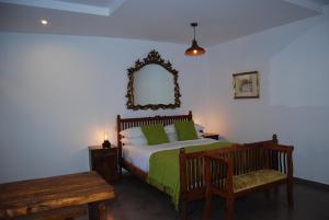 A bed or beds in a room at Pebbles of Kioni
