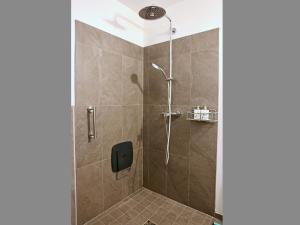 a shower with a glass door in a bathroom at Ferienwohnungen Mittermayer in Aschau im Chiemgau +39 photos