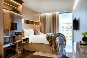 Voodi või voodid majutusasutuse Hotel Riverton toas