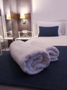 A bed or beds in a room at Marina Hotel Bodrum