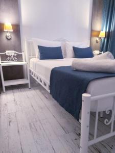 A bed or beds in a room at Marina Hotel Bodrum