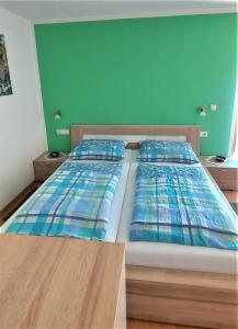 Postel nebo postele na pokoji v ubytování B&B Gasthaus Lieg