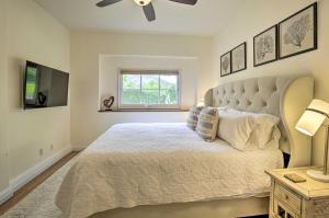 a bedroom with a large bed and a window at Rancho Santa Fe Casita - Gate Guarded Community! in Rancho Santa Fe
