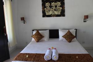 Postel nebo postele na pokoji v ubytování Magus Homestay