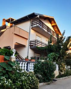 a building with balconies on the side of it at Apartment Gloria in Zadar