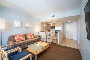a living room with a couch and a table at Sunny Isles 1BDR Sea View and Pool in Miami Beach