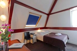 Een bed of bedden in een kamer bij Hotel de Gaaper