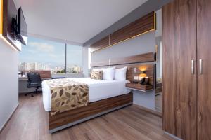 Postel nebo postele na pokoji v ubytování Sleep Inn Ciudad de Mexico Cuajimalpa + 24 fotografií