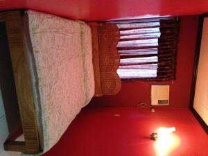 Кровать или кровати в номере RM Guest House