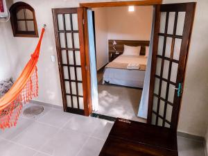 En eller flere senge i et værelse på Pousada Mata Nativa
