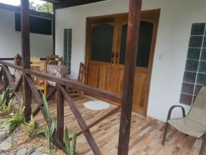 a room with a wooden door and a wooden floor at Hostal Cecilia in Puerto Viejo