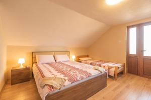 a bedroom with two beds and a window at Villa Vadian & Pool in Gevgelija +34 photos