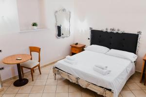 Llit o llits en una habitació de Hotel Ristorante Garibaldi