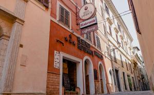 a building with a sign on the side of it at Hotel Ristorante Garibaldi in Frosinone