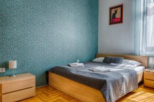 a bedroom with a bed and a desk at Central Capital Apartments in Budapest