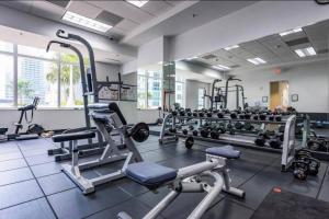 a gym with several treadmills and machines at Spectacular Studio at Brickell, Free Parking in Miami