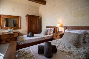Ένα ή περισσότερα κρεβάτια σε δωμάτιο στο Mandolina Casa