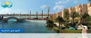 a rendering of a resort with a river and a bridge at شاليه بقرية أندلسيه بمطروح يرى البحر in Marsa Matruh