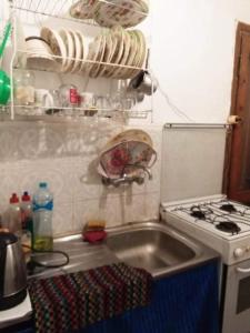a kitchen with a sink and a stove at شاليه بقرية أندلسيه بمطروح يرى البحر in Marsa Matruh