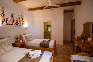 A bed or beds in a room at Orchidea Xaghra
