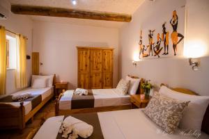 A bed or beds in a room at Orchidea Xaghra