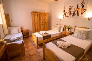 A bed or beds in a room at Orchidea Xaghra