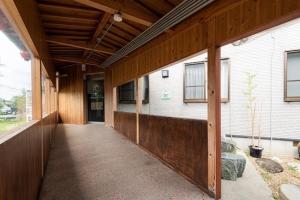 an empty hallway of a house with a building at Hotel Sunmarine in Tarui