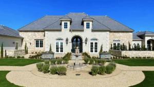 a large house with a fountain in the front yard at Domaine Chardonnay in Temecula