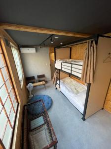an overhead view of a room with two bunk beds at Arura Sapporo in Sapporo