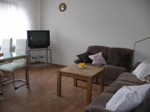 TV a/nebo společenská místnost v ubytování Ferienwohnung Herrig + 7 fotografií