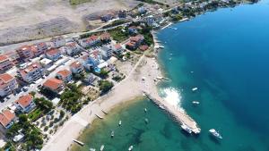 an aerial view of a beach with boats in the water at Apartments Barbati in Novalja