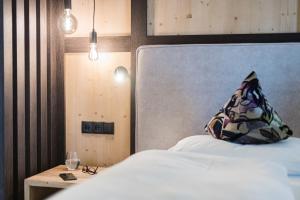 Postel nebo postele na pokoji v ubytování myLoisl Apartments