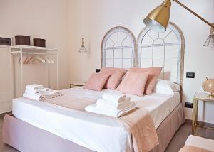 Postel nebo postele na pokoji v ubytování Dimora Terranova Charming Rooms