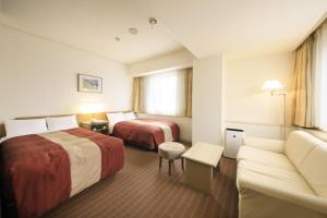 Postel nebo postele na pokoji v ubytování Hotel Nagano Avenue + 37 fotografií