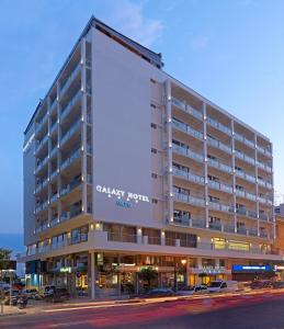 a large building with a large sign on the side of it at Airotel Galaxy in Kavála