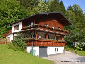 a house on a hill with at Appartement Petra in Kössen