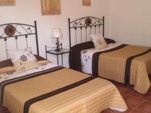 Postel nebo postele na pokoji v ubytování Hostal El Canario