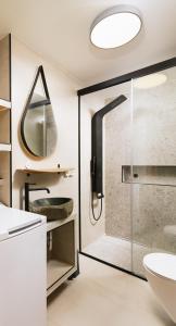 a bathroom with a shower and a sink at ROOF GARDEN SUITE in Matala