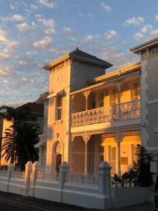 a large white building with a clock tower at NOAH House in Cape Town