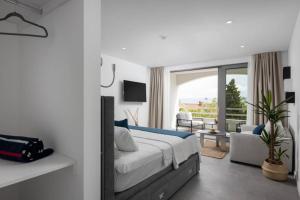 a bedroom with a bed and a living room at Holiday in Bol **** blue in Bol