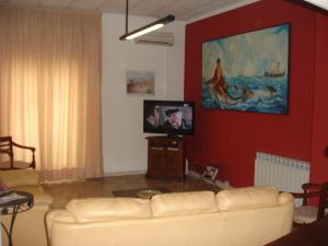 TV a/nebo společenská místnost v ubytování Hotel La Rusticana