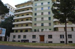 a tall apartment building with a tree in front of it at AL171 Tourist Rental close Metro B1 - Sant'Agnese Annibaliano in Rome