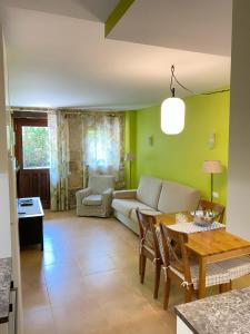 a living room with a couch and a table at Apartamentos Playa Galizano in Galizano
