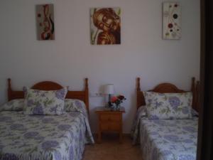 Postel nebo postele na pokoji v ubytování Hostal El Canario