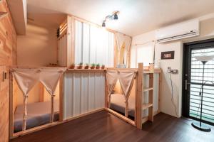 Katil dua tingkat atau katil-katil dua tingkat dalam bilik di Yilan Inspiration