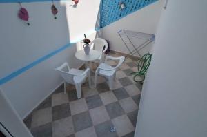a small table and chairs in a small room at Marianthi Studios Stegna in Archangelos