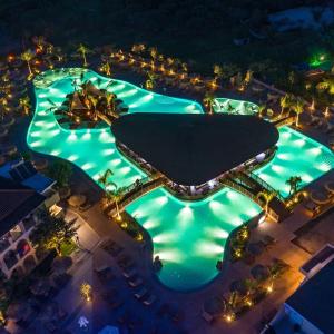 an overhead view of a pool at night at Letsos Hotel in Alykes