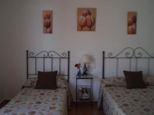 Postel nebo postele na pokoji v ubytování Hostal El Canario