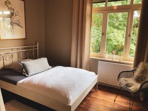 Een bed of bedden in een kamer bij Ring Residenz by E&P Concept