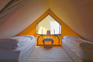 En eller flere senge i et værelse på Nomad Knokke